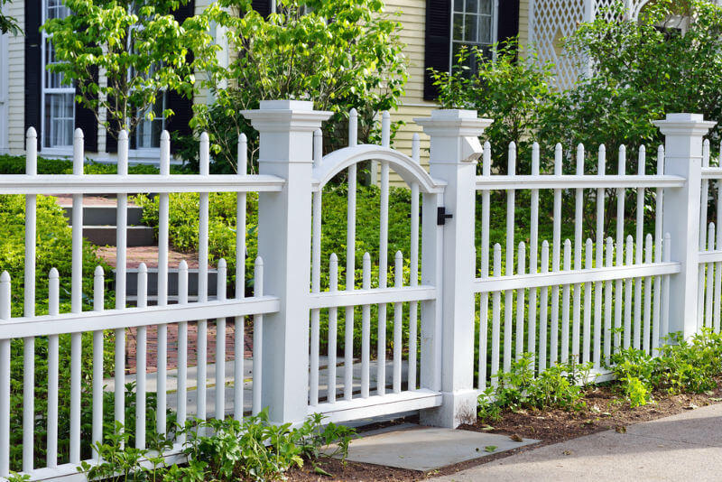 decorative white wooden gate and fence